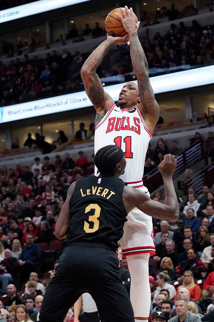 Feb 28, 2024; Chicago, Illinois, USA; Chicago Bulls forward DeMar DeRozan (11) shoots the ball over Cleveland Cavaliers guard Caris LeVert (3) during the first quarter at United Center. Mandatory Credit: David Banks-USA TODAY Sports